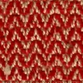 Knitted fabric texture, red and off-white chevron pattern, dense weave with subtle sheen, suggesting a rustic or hand-knitted quality.